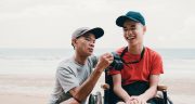 disabled-boy-and-caregiver-taking-photo