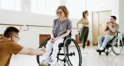 disabled-girl-on-wheelchair-exercising-with-caregiver